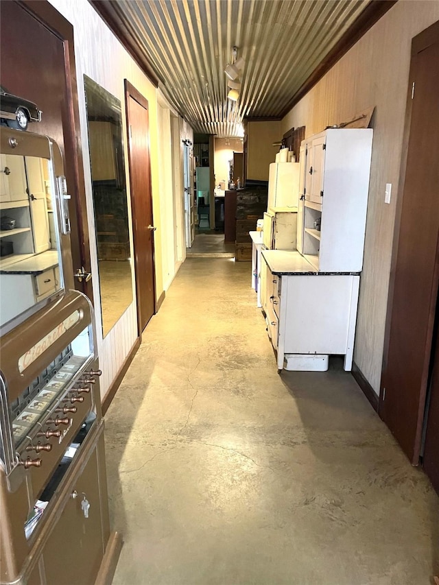 corridor featuring finished concrete flooring