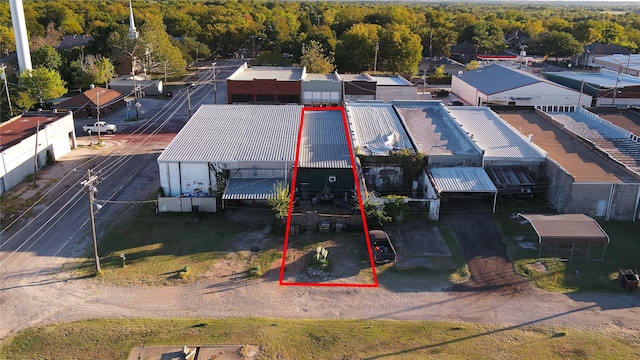 birds eye view of property with a view of trees