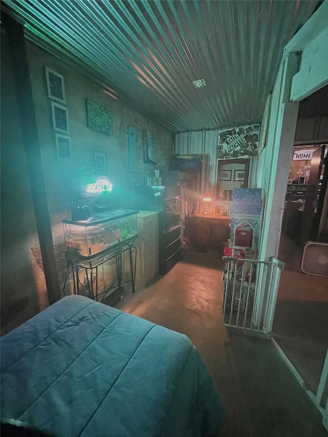 bedroom featuring concrete flooring