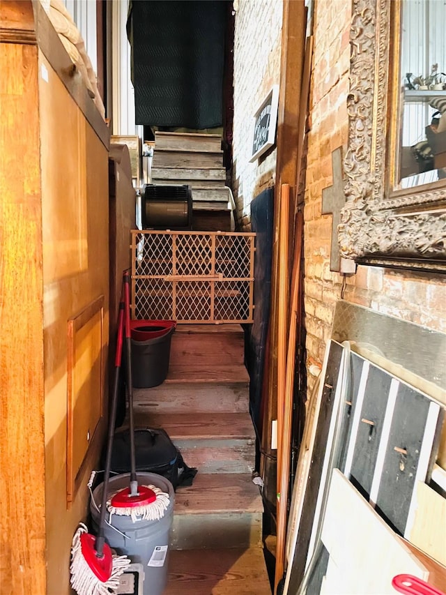 stairway featuring wood finished floors