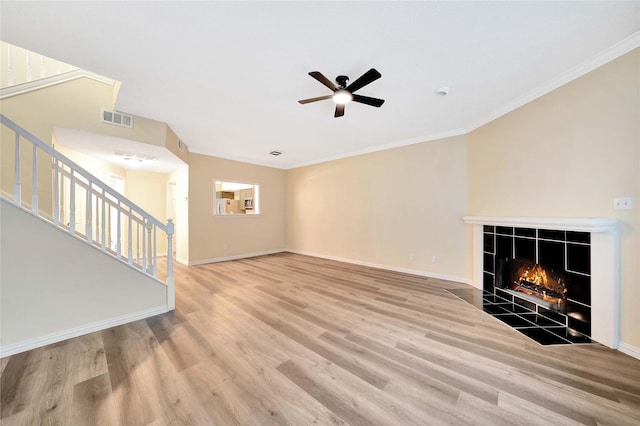 entryway featuring stairs, wood finished floors, and visible vents