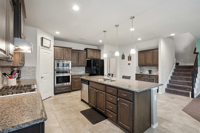 kitchen featuring dark brown cabinets, recessed lighting, tasteful backsplash, a sink, and appliances with stainless steel finishes
