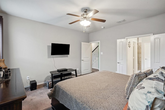 carpeted bedroom with a ceiling fan, baseboards, and visible vents