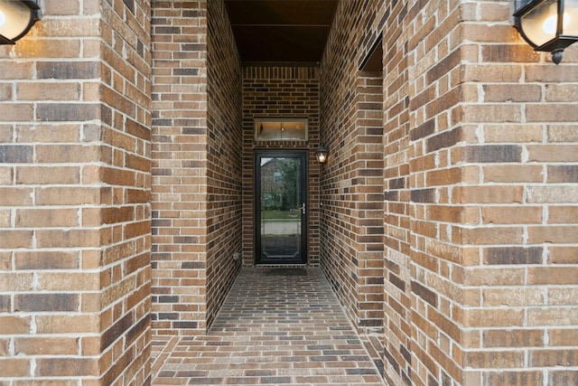 entrance to property with brick siding