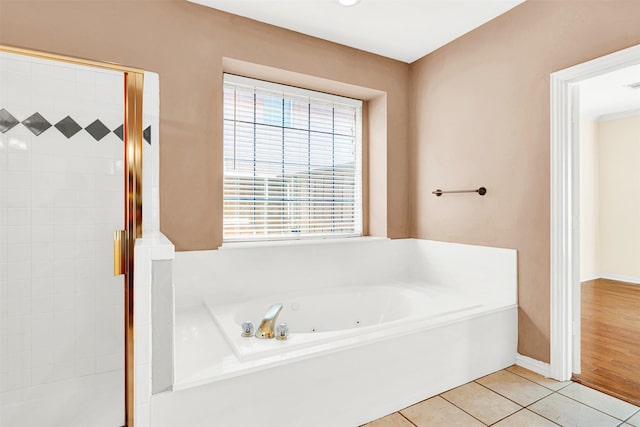 3837 Evesham Dr, Plano, TX 75025 - bathroom featuring a whirlpool tub, tile patterned floors, a shower, and baseboards
