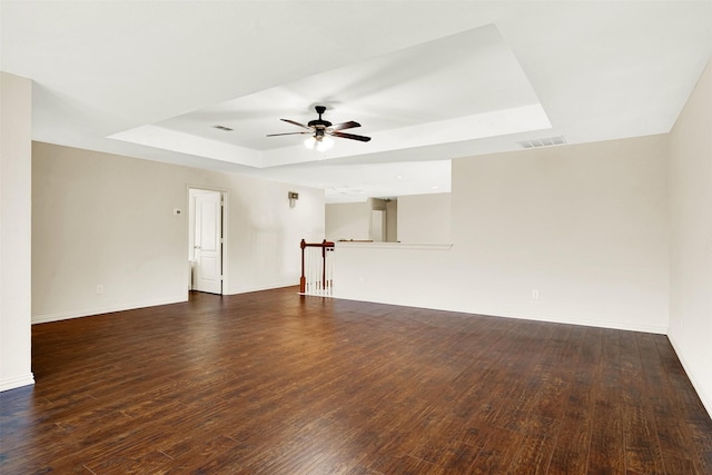 3837 Evesham Dr, Plano, TX 75025 - empty room with a raised ceiling, a ceiling fan, wood finished floors, and baseboards