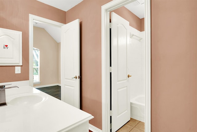 full bath with bathing tub / shower combination, tile patterned flooring, and vanity