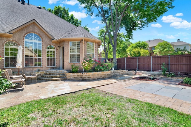 exterior space with a fenced backyard