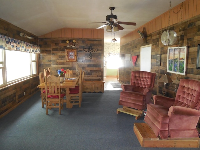 126 County Road 541, Eastland, TX 76448 - carpeted dining room featuring wooden walls, ceiling fan, and vaulted ceiling