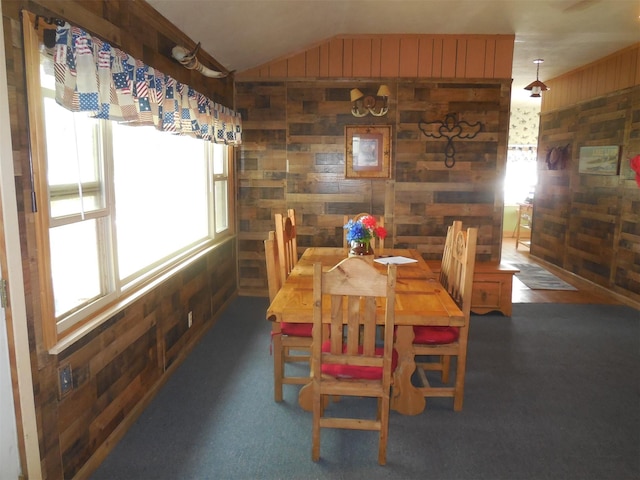 126 County Road 541, Eastland, TX 76448 - dining space featuring lofted ceiling and wooden walls