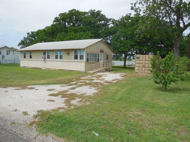 126 County Road 541, Eastland, TX 76448 - view of front facade with a front lawn, fence, and metal roof