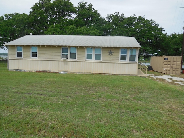 126 County Road 541, Eastland, TX 76448 - view of front of home with cooling unit, metal roof, and a front yard