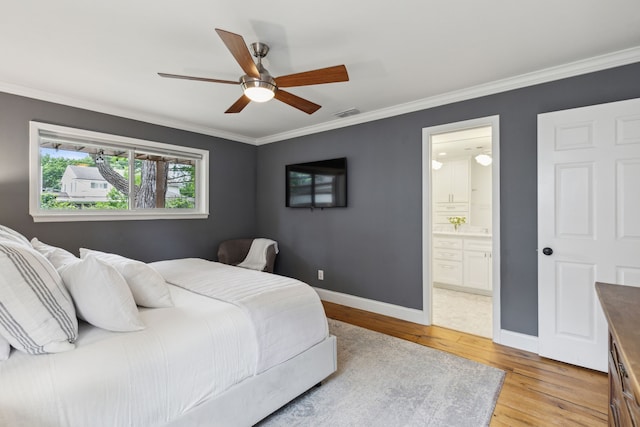 bedroom featuring crown molding, baseboards, light wood-style flooring, and visible vents