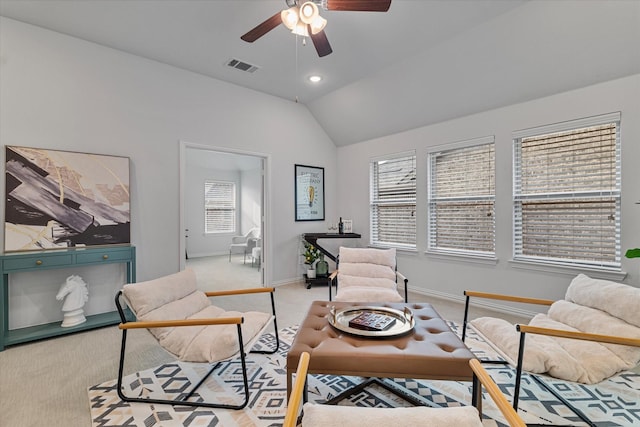 carpeted living room with lofted ceiling, a ceiling fan, and baseboards