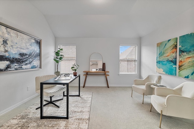 office space with vaulted ceiling, carpet flooring, healthy amount of natural light, and baseboards