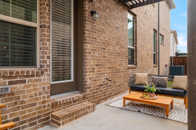 view of patio / terrace with central AC and fence