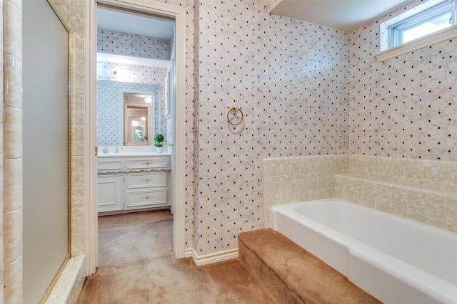 full bathroom with a bath, a shower stall, vanity, baseboards, and wallpapered walls