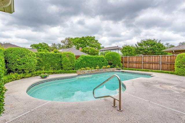 view of swimming pool with a patio, a fenced in pool, and a fenced backyard