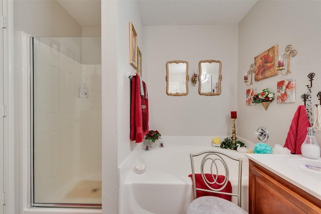 bathroom featuring vanity, a shower stall, and a bath