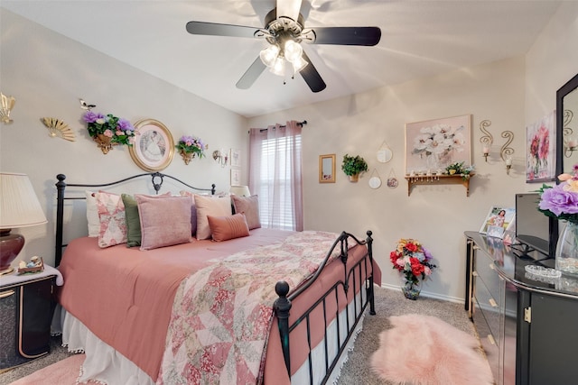 bedroom with baseboards, light colored carpet, and ceiling fan