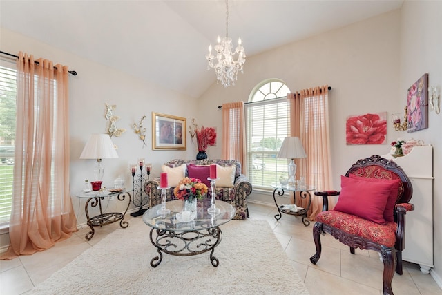 living area featuring tile patterned flooring, a chandelier, and high vaulted ceiling