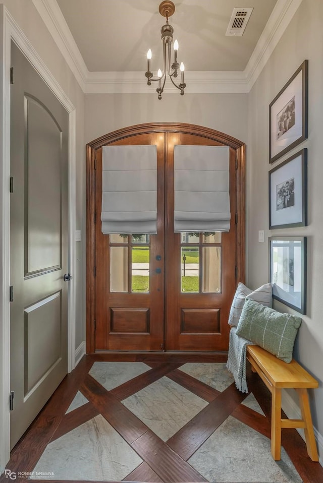 1113 Cypress Creek Cir, Shreveport, LA 71106 - entrance foyer with french doors, visible vents, ornamental molding, and an inviting chandelier