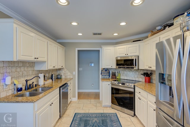 3666 Crestview Dr, Shreveport, LA 71119 - kitchen featuring appliances with stainless steel finishes, a sink, backsplash, visible vents, and ornamental molding