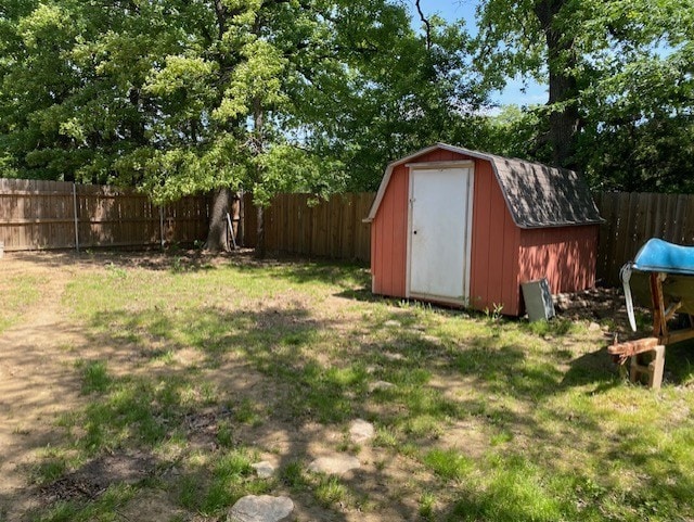 view of shed featuring a fenced backyard