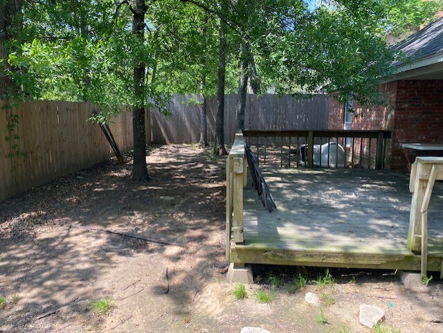 wooden deck featuring fence