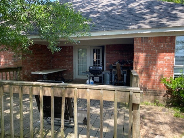 wooden deck featuring grilling area