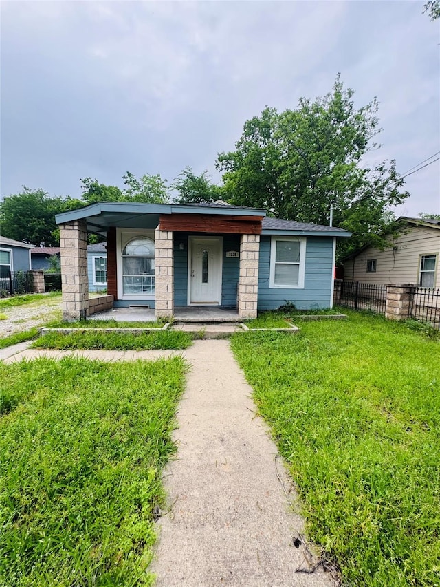 7539 Red Bud Dr, Dallas, TX 75227 - bungalow featuring fence, a porch, and a front yard
