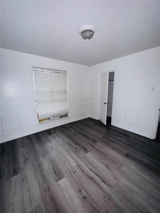 7539 Red Bud Dr, Dallas, TX 75227 - empty room with dark wood-type flooring