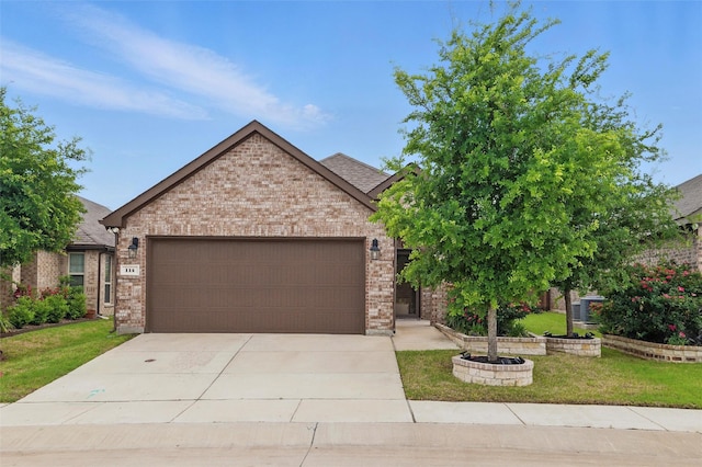 view of front of home with concrete driveway, brick siding, a front lawn, and a garage