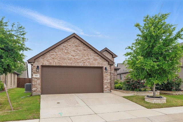 view of front of house with brick siding, driveway, central AC unit, and a garage