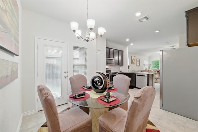 dining space featuring an inviting chandelier, recessed lighting, light tile patterned flooring, and visible vents