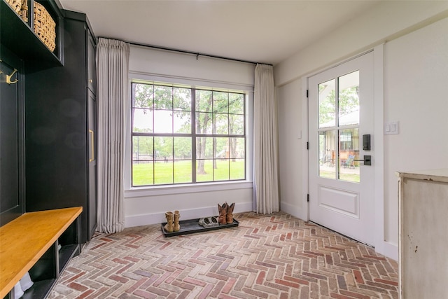 interior space featuring brick floor and a wealth of natural light