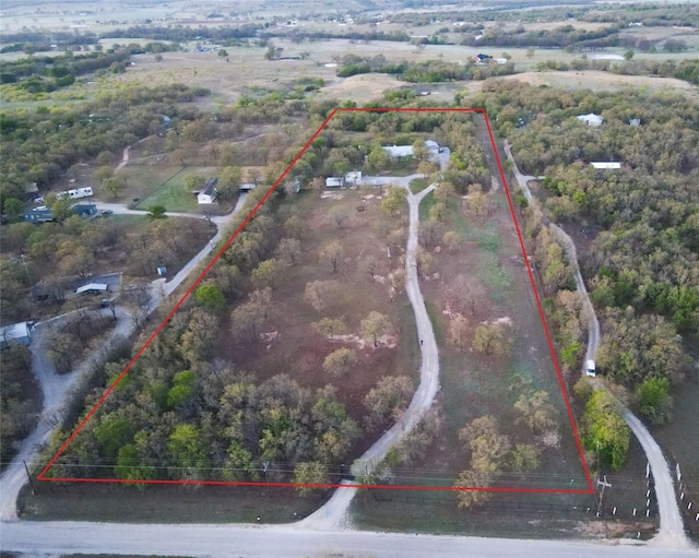 birds eye view of property with a rural view