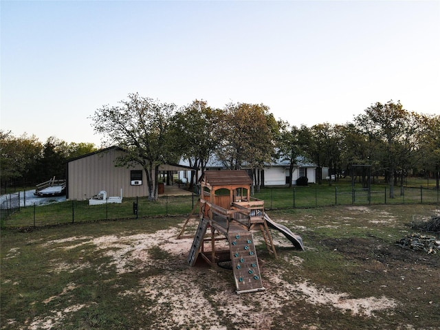 view of yard with a playground and fence