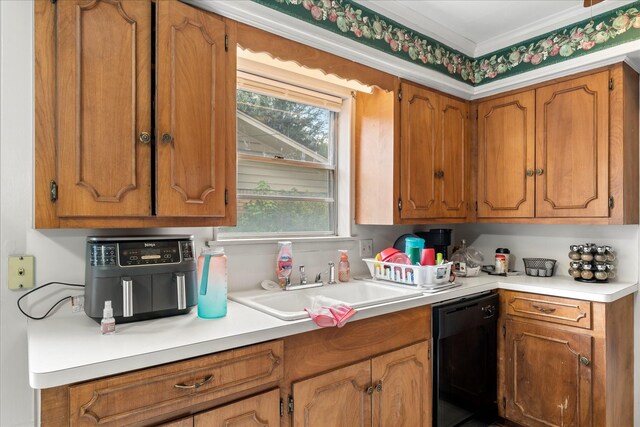 kitchen featuring light countertops, brown cabinetry, a sink, and dishwasher