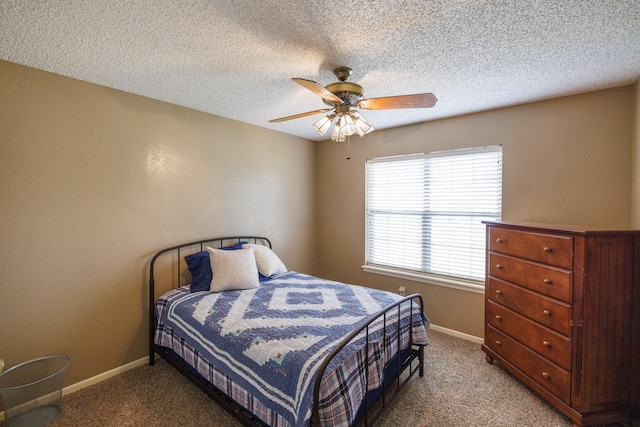 bedroom featuring carpet floors, a ceiling fan, and baseboards