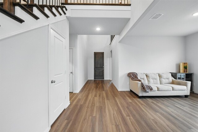 entryway with recessed lighting, baseboards, and wood finished floors