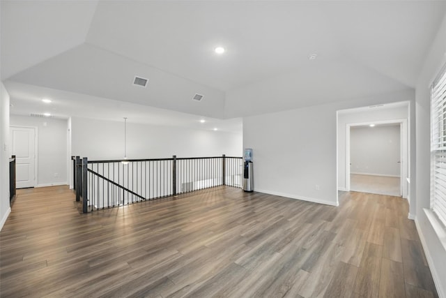 421 Acton Ave, Fort Worth, TX 76131 - unfurnished room with wood finished floors, lofted ceiling, and visible vents