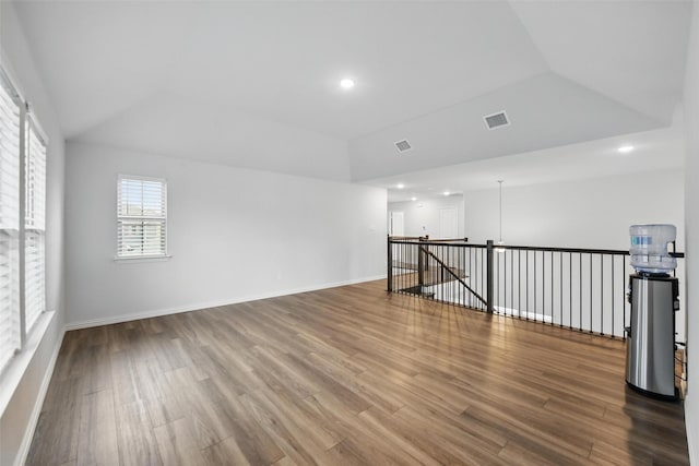 421 Acton Ave, Fort Worth, TX 76131 - spare room with baseboards, wood finished floors, and lofted ceiling
