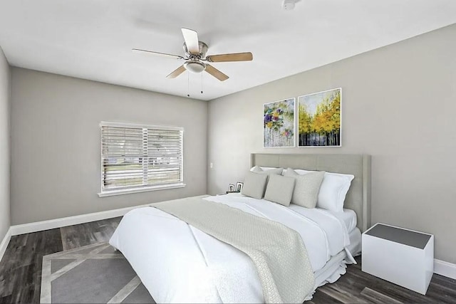 bedroom featuring baseboards, ceiling fan, and wood finished floors