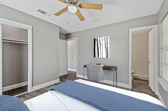 bedroom featuring baseboards, visible vents, and wood finished floors