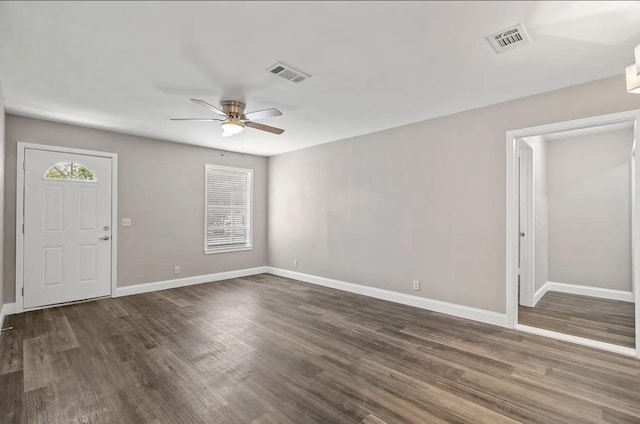 entrance foyer featuring ceiling fan, visible vents, baseboards, and dark wood finished floors