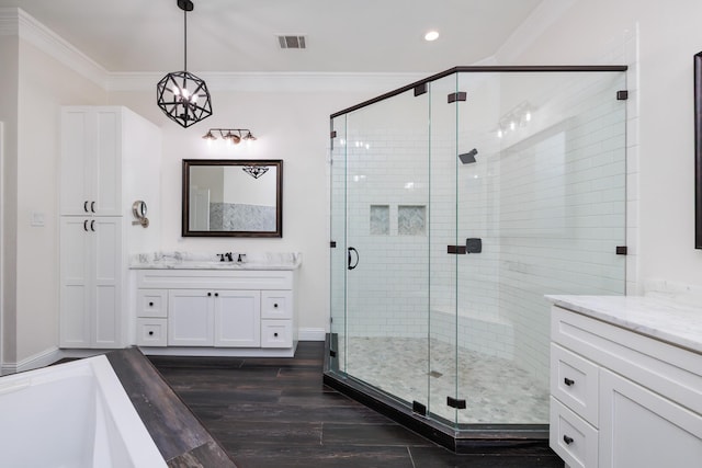 full bath with visible vents, ornamental molding, and a shower stall
