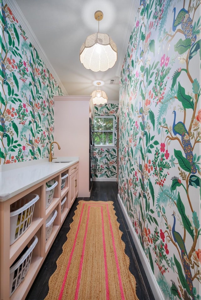 bathroom with crown molding, vanity, and visible vents