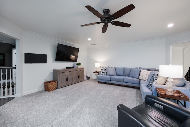 carpeted living area with a ceiling fan, baseboards, recessed lighting, and ornamental molding