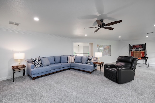 living room featuring visible vents, ornamental molding, carpet floors, recessed lighting, and a ceiling fan